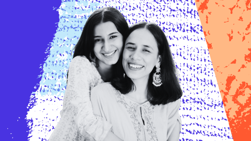 A mother and daughter hugging and smiling