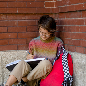 Child writing in a notebook