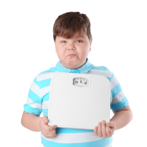 Child holding a scale