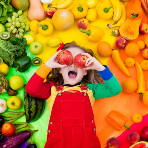 Kid surrounded by vegetables