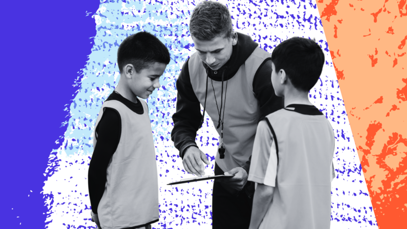 Coach talking to kids