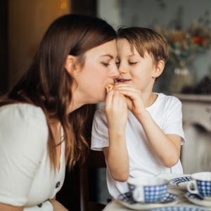 Parent with child eating together