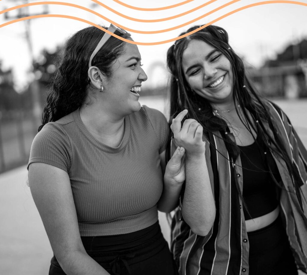 Two people laughing and smiling