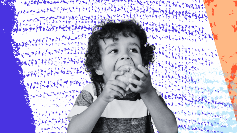 child eating an apple