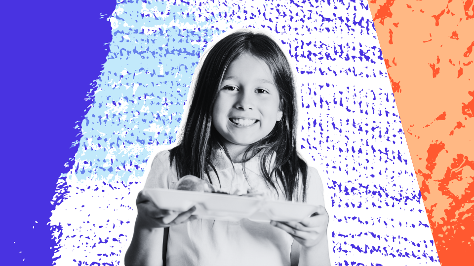 Smiling child holding a school lunch tray against a colorful background, representing positive food choices at school.