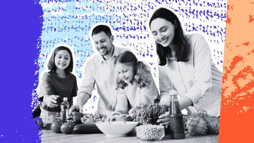 Parents and children preparing food together at the kitchen table, modeling a relaxed, supportive approach to eating and listening to hunger and fullness cues.